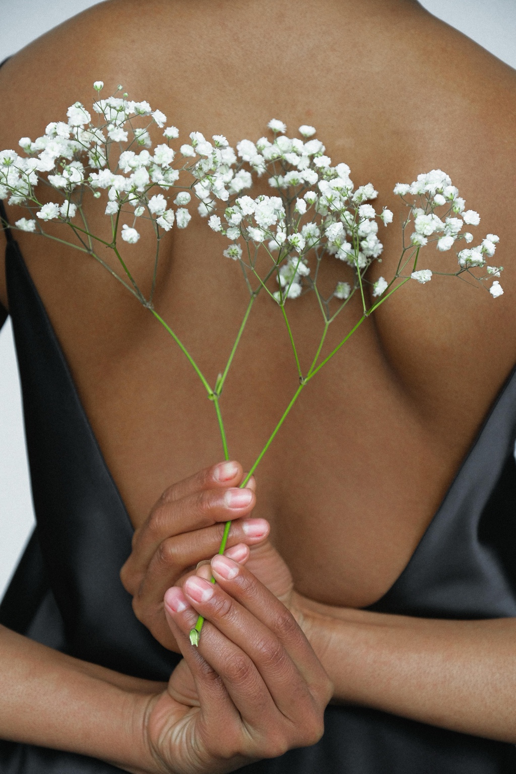 Woman holding white flowers